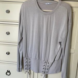 Women’s casual sweatshirt w/cute lacing around the waist very flattering